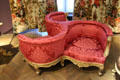 Circular chair for three in Second Empire style covered in silk damask by Benjamin Deguil & Benjamin-Paul Ramillon at Museum of Decorative Arts. Paris, France.