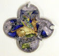 Enameled silver medallion with bull symbol of St Luke Evangelist from Catalonia at Cluny Museum. Paris, France.