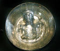 Bowl with symbol of Africa including woman wearing helmet in form of elephant on Roman silver vessel buried by eruption of Mount Vesuvius at Louvre Museum. Paris, France.