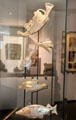 Blown glass flasks in shape of galley ship & fish from Afghanistan at Guimet Museum. Paris, France.