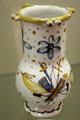 Earthenware puzzle jug painted with standard of unknown order & inscribed La Loi made by Faïence de Never at Carnavalet Museum. Paris, France.