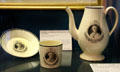 Earthenware coffee pot, cup & saucer with portrait of Jacques Necker, highly regarded finance minister for Louis XVI & inscription "the hope & support of France" by unknown maker at Carnavalet Museum. Paris, France.