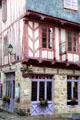 Half-timbered building with carved figures on rue Bienheureux Pierre René Rogues. Vannes, France.
