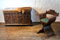 Ornate carved chest & X-shaped antique-inspired wooden chair which can be folded & carried at Jacques Cartier Manor House Museum. St Malo, France.