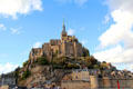 Mont-St-Michel abbey with town buildings & walls below. Mont-St-Michel, France.