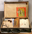 French child's evacuation suitcase & kit with ID bracelet at Caen Memorial. Caen, France