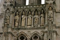 Left side of Kings' Gallery with life-sized figures on front of Amiens Cathedral. Amiens, France.
