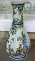 Rouen-made earthenware octagonal bottle painted with Chinese scene in multiple colors at Rouen Ceramic Museum. Rouen, France.