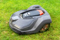 Robot lawn mower working on vast lawn of Naples Terrace at Chateau Royal of Amboise. Amboise, France.