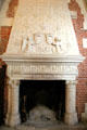 Trapezoidal carved marble fireplace decorated with royal emblems in Council Chamber, Royal Lodge at Chateau Royal of Amboise. Amboise, France.