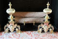 Dining room fireplace firedogs from time of King Louis XIV at Cheverny Chateau. Cheverny, France.