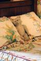 Stuffed bear on bed in nursery at Cheverny Chateau. Cheverny, France.