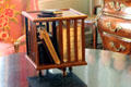 Small tabletop rotary bookshelf in Petit Salon at Cheverny Chateau. Cheverny, France.