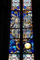 Modern stained glass honoring St Aignan Bishop of Orleans who helped repel assault of Attila's Huns by Pierre Carron at Orleans Cathedral. France.