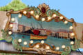 Painting of fishing boat in harbor in carousel in Jardin Albert 1er, Promenade du Paillon. Nice, France.