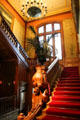 Entrance staircase with carved newel post at Lumière Museum. Lyon, France.