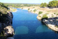 Shadow of Pont du Gard on Gard River. Nimes, France.