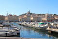 Marseille harbor with Basilique Notre-Dame de la Garde on hill beyond. Marseille, France.