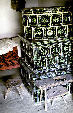Tile stove in Szenna Open Air Museum. Hungary.