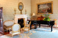 Fireplace & piano in state drawing room at Aras an Uachtarain. Dublin, Ireland.
