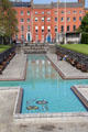 Cruciform pool of Garden of Remembrance with symbolic mosaic of discarded weapons on bottom of flowing river. Dublin, Ireland.