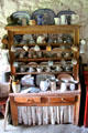 Cupboard filled with tableware at Kissane's farm at Muckross Traditional Farms in Killarney National Park. Killarney, Ireland.