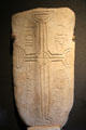 Grave slab reading "prayer for Odran who had knowledge" in Irish at Clonmacnoise museum. Ireland.
