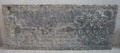 Tomb slab engraved with blackletter inscription left incomplete because of error during carving at Medieval Mile Museum. Kilkenny, Ireland.