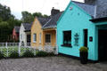 Row of slate roofed multi-colored cottages. Adare, Ireland.