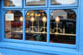 Multi-pane window with brass lights. Adare, Ireland.