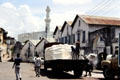 Unloading a truck amongst buildings in old town Mombasa. Kenya.