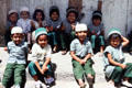 Indian school children smile for camera in old town Mombasa. Kenya.
