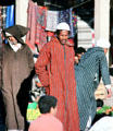 Men in traditional dress in souk. Erfoud, Morocco.