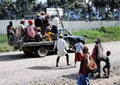 War party ride in pickup truck on road near Banz. Papua New Guinea.
