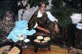 Serving meal in traditional manner. Tunis, Tunisia.