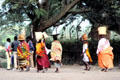 Women carrying groceries on their heads in Arusha. Tanzania.