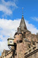 Cock weathervane & cantilevered clock on tower of Canongate Tollbooth. Edinburgh, Scotland.
