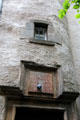Ancient wall with faded boot maker sign on Lady Stair's Close opposite Writers' Museum. Edinburgh, Scotland.