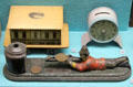 Soldier firing penny into vault on mechanical Wimbledon Bank & other coin banks at Museum of Childhood. Edinburgh, Scotland.