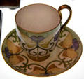 Cup & saucer painted by Helen Walton of Glasgow School or Art at Kelvingrove Art Gallery. Glasgow, Scotland.