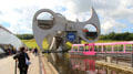 Falkirk Wheel rotates boats between elevated & lower level canal while keeping tubs in which boats float level. Falkirk, Scotland