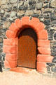Red stone entrance arch at Smailholm Tower. Scotland