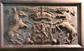 Carved plaque with Scottish royal arms with unicorns initialed MR at Traquair House. Scotland.