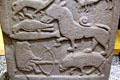 Pictish cross-slab detail of hunter facing boar at St Vigeans Museum. Arbroath, Scotland.