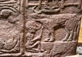 Pictish cross-slab detail shows pagan man drinking bull's blood at St Vigeans Museum. Arbroath, Scotland.