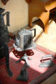 Metal teapot on stand in D MacPherson Tailor & Outfitter shop at Highland Folk Museum. Newtonmore, Scotland.