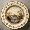Queen's Ware dessert plate with painted Aysgarth Bridge, Yorkshire by Wedgwood at World of Wedgwood. Barlaston, Stoke, England.