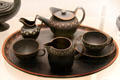 Black Basalt breakfast set with encaustic enamel by Wedgwood at World of Wedgwood. Barlaston, Stoke, England.