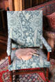 Golden Stem woven wool seat & back covers by John Henry Dearle for Morris & Co on English oak armchair with H stretcher at Wightwick Manor. Wolverhampton, England.
