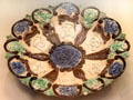 Glazed earthenware dish by Edward Bingham Junior for Castle Hedingham Pottery, Essex at British Museum. London, United Kingdom.